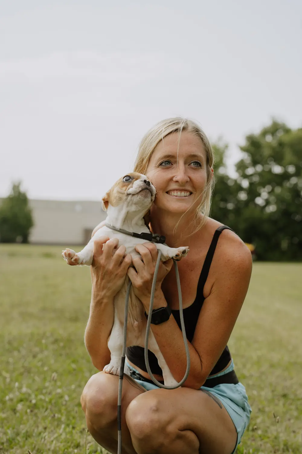 Trainer holding a puppy